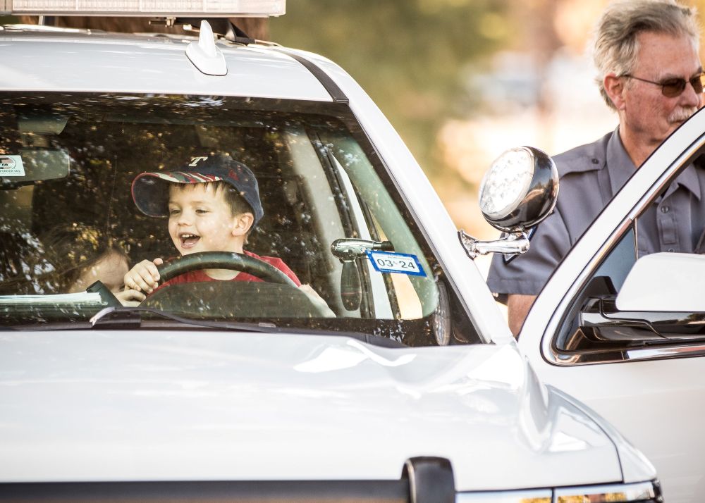 Image of child in Richardson Police Department Vehicle during the 2024 Public Safety Expo